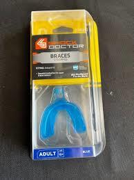 PROTECTEURS BUCCAUX SD BROCHES/BRACES AVEC ATTACHE/STRAPPED ADL.